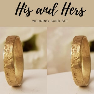 May include: Two gold wedding bands with a hammered texture. His and Hers Wedding Band Set.