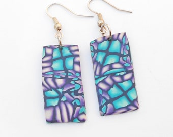 Polymer clay rectangle earrings with abstract design.