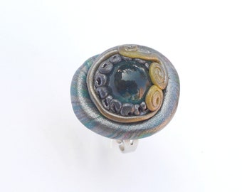 Polymer clay ring with glass bead