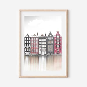 May include: A photograph of a row of colorful buildings reflected in a canal. The buildings are a mix of red, black, and white. The water is calm and reflects the buildings.