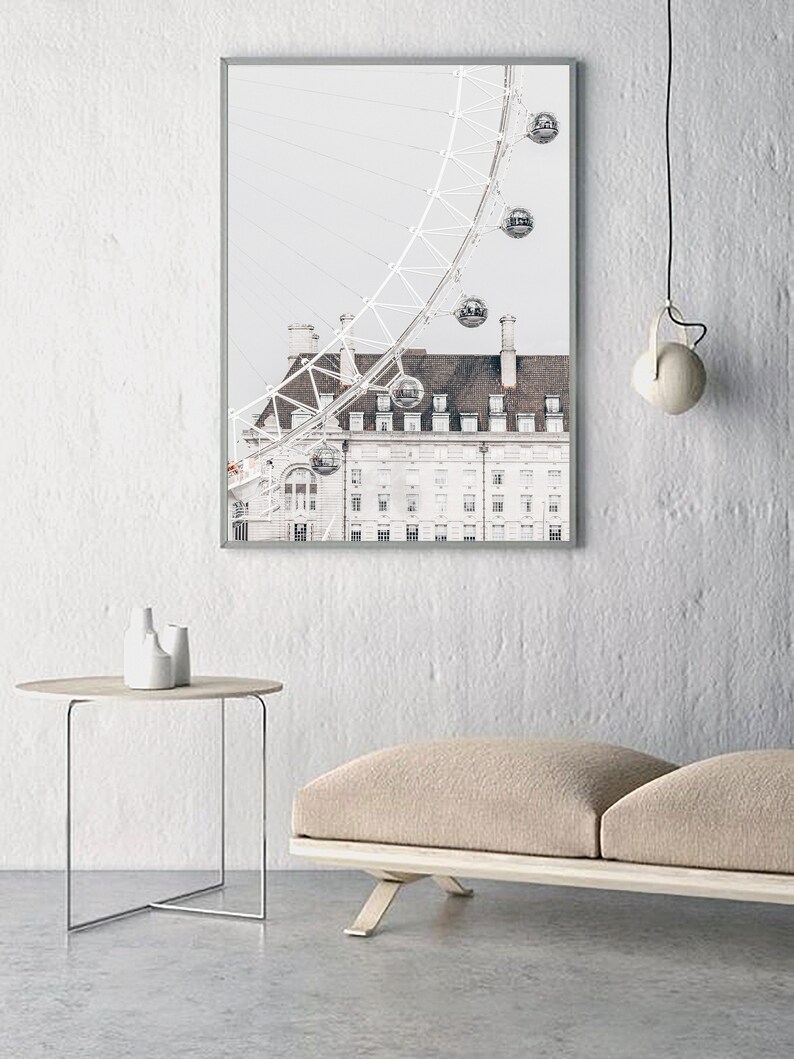 May include: A framed photograph of a white building with a large Ferris wheel in the background. The Ferris wheel is partially visible and has several gondolas. The building has a tiled roof and many windows.