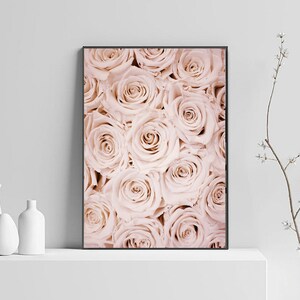 May include: A close-up image of a bouquet of pale pink roses. The roses are arranged in a tight cluster, with their petals overlapping and creating a soft, romantic effect.