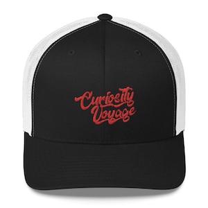 May include: Black and white trucker hat with a red embroidered logo that says "Curiosity Voyage".