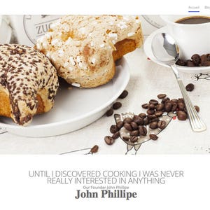 May include: Two sweet breads, one with chocolate sprinkles and one with white sprinkles, are on a white plate with coffee beans scattered around the plate. The quote "Until I discovered cooking I was never really interested in anything" is below the image, with the name "John Phillipe" underneath.