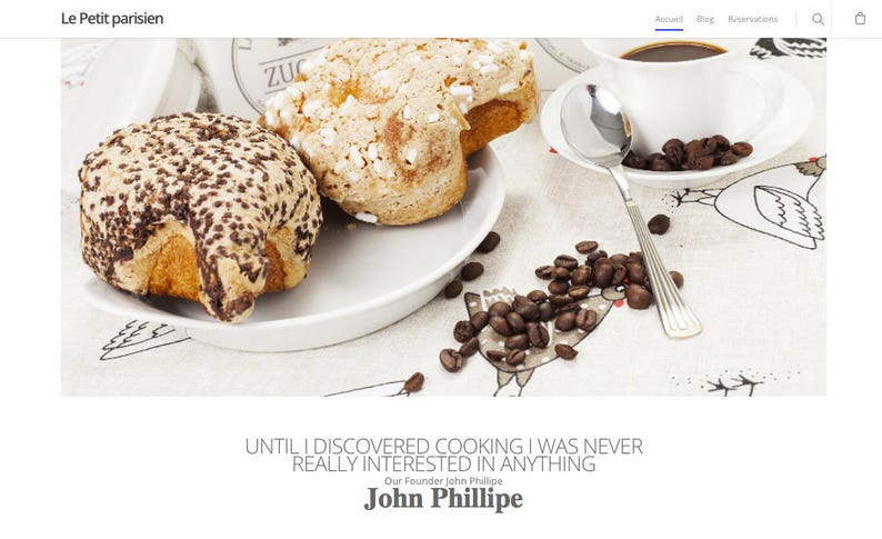 May include: Two sweet breads, one with chocolate sprinkles and one with white sprinkles, are on a white plate with coffee beans scattered around the plate. The quote "Until I discovered cooking I was never really interested in anything" is below the image, with the name "John Phillipe" underneath.