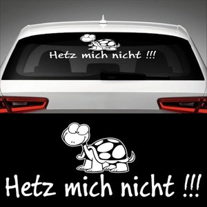 May include: A white turtle sticker with the text "Hetz mich nicht!!!" on a black background. The turtle is cartoon-like and has a big smile.