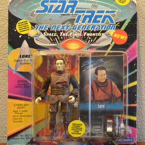 May include: A Star Trek: The Next Generation action figure of Lore, Data's evil twin brother. The figure is wearing a brown and black outfit with a belt and is holding a phaser. The figure comes with a bonus Starfleet action base and a Skybox Playmates collector card. The packaging is colourful and features the Star Trek logo and the words "Space. The Final Frontier."