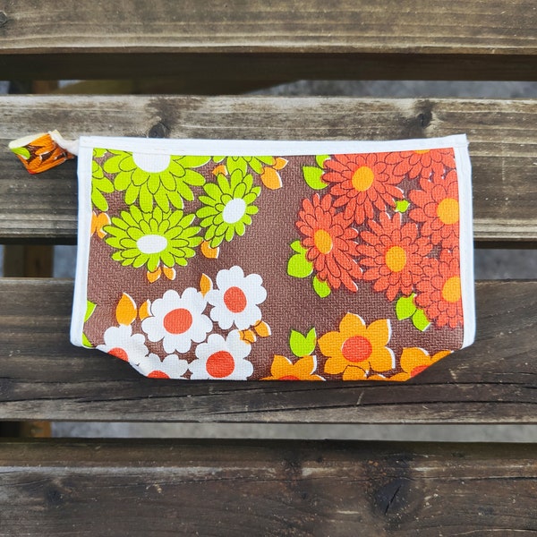 Trousse de toilette vintage noire avec fleurs rouges, orange, vertes, blanches