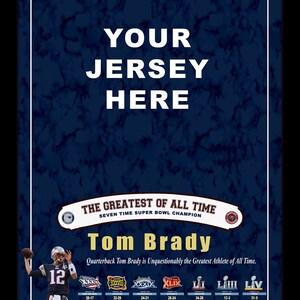 May include: Poster with a dark blue marble background featuring the text "YOUR JERSEY HERE" and images of Tom Brady. Includes text: "SEVEN-TIME SUPER BOWL CHAMPION, 5-TIME SUPER BOWL MVP" and "THE GREATEST OF ALL TIME".