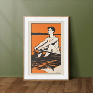 Puede incluir: Arte de póster vintage enmarcado que representa a un remero en un bote en un lago. La obra de arte tiene una combinación de colores naranja y negro con un borde color crema. El remero lleva un uniforme blanco con la letra "C" naranja.