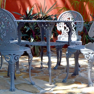 vintage victorian style patio outdoors garden dining set table and four chairs lead gray elegant classic style summer miami florida