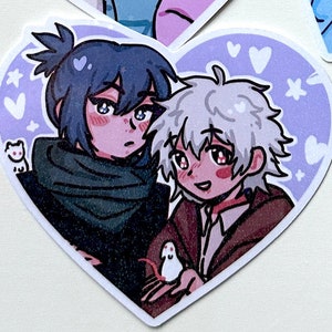 May include: A heart-shaped sticker with two anime characters, one with blue hair and a green scarf, and the other with white hair, holding a small white mouse. The background is a light purple with white hearts and stars.