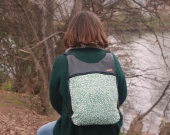 Black leather backpack with vine