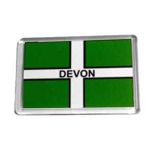 May include: A white and green rectangular magnet with the word "DEVON" in black letters.
