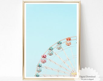May include: A framed print featuring a Ferris wheel against a light blue sky. The Ferris wheel has colorful gondolas in shades of red, orange, and teal. The print is labeled "Digital Download" and "PRINTABLE" with the text "OH FINE! ART PRINTS".
