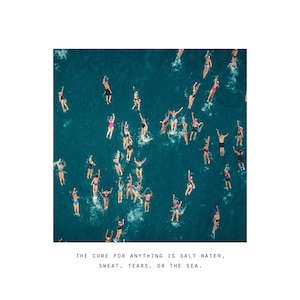 May include: An aerial view of a group of people swimming in a turquoise blue ocean. The caption reads "THE CURE FOR ANYTHING IS SALT WATER, SWEAT, TEARS, OR THE SEA."