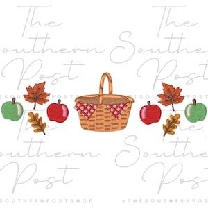 May include: An embroidery design featuring a central brown woven basket with a red and white checkered cloth, flanked by two red apples, two green apples, two orange maple leaves, and two brown oak leaves, with the text The Southern Post.