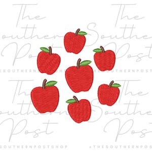 May include: An embroidery design featuring six red apples with green leaves arranged in a circular pattern. The text "The Southern Post" and "THESOUTHERNPOSTSHOP" is overlaid in a light gray script font across the center of the image.