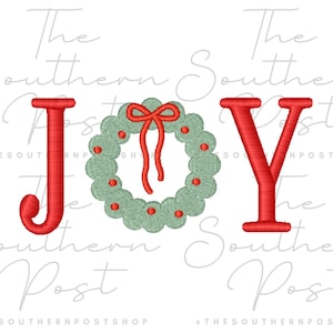 May include: Embroidered design spelling "JOY" with a Christmas wreath replacing the "O". The letters are red, and the wreath is green with a red bow. The background is white.