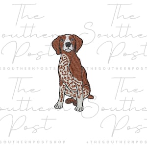 May include: An embroidered patch featuring a seated dog with brown and white markings. The dog has brown ears and a white patch on its face. The text "The Southern Post" and "@THESOUTHERNPOSTSHOP" are in the background.