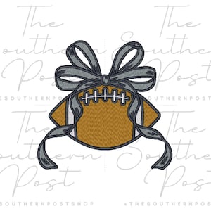 May include: An embroidered football design with a gray bow and ribbons. The football is brown with white stitching and white stripes. The bow and ribbons are gray. The design is on a white background.