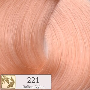 May include: A close-up of a light peach hair color swatch. The swatch is labeled "221 Italian Nylon".