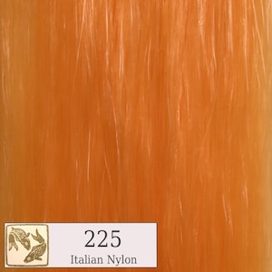 May include: A close-up of a bright orange nylon yarn with the number 225 and the text "Italian Nylon".