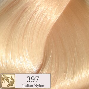 May include: A close-up of a light blonde hair color swatch. The swatch is labeled "397 Italian Nylon".