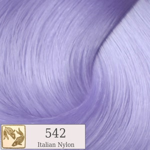 May include: Close-up of a swatch of light purple nylon fiber. The fibers are wavy and textured, with highlights and shadows. A small rectangular label in the lower left corner displays the number "542" and the words "Italian Nylon".