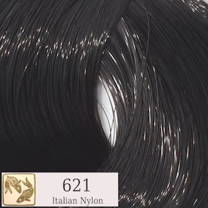 May include: Close-up of a black nylon yarn with a label that reads "621 Italian Nylon".