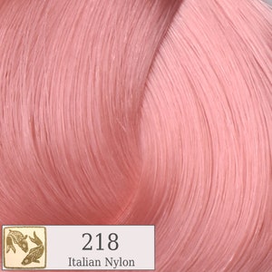 May include: A close-up of a pink hair color swatch with the number 218 and the text "Italian Nylon".