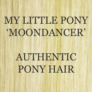 May include: The image displays text against a light-coloured backdrop. The text reads "MY LITTLE PONY 'MOONDANCER' AUTHENTIC PONY HAIR". The background has a vertical, textured pattern.