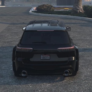 May include: Rear view of a black SUV with a license plate. The vehicle has a sleek design with dual exhaust pipes and tinted windows. The taillights are illuminated, and the car is parked on an asphalt surface.