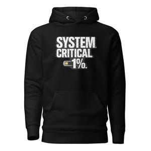 May include: Black hooded sweatshirt with a front pocket and a drawstring hood. The white text on the front reads "SYSTEM CRITICAL 1%" with a battery icon. A casual, comfortable garment.