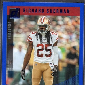 RICHARD SHERMAN 2018 Donruss #258 Press Proof Blue Parallel Football Card - San Francisco 49ers