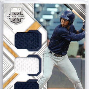 May include: A baseball card featuring a baseball player in a blue jersey and white pants. The card is part of the Elite Extra Edition series. The player's name is Jesus Sanchez and he plays for the Tampa Bay Rays. The card number is 64/117.