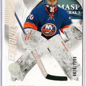 May include: A hockey trading card depicting Ilya Sorokin, the New York Islanders' goaltender. The card shows Sorokin in his blue and orange team kit, wearing a helmet and goalie pads. The card includes the text "SP Rookie Authentics" and "0610/1299".