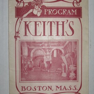 May include: A vintage programme for Keith's Theatre in Boston, Massachusetts. The programme features a red and white design with a woman in a red dress and a black hat. The programme also includes a photograph of the theatre's interior.