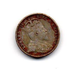 May include: A vintage coin with a profile of a crowned figure, likely a king or emperor, facing right. The coin's edge is marked with text, and the overall color is a mix of brown and copper, suggesting age and wear. The coin is set against a white background.