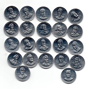 May include: A collection of silver-colored commemorative coins, each featuring a portrait of a U.S. President. The coins are arranged on a white surface, with text indicating the president's name and term.