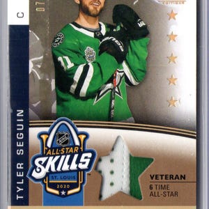 May include: A hockey trading card featuring Tyler Seguin in a green and white jersey. The card includes the text "NHL All-Star Skills 2020" and "Veteran 6 Time All-Star". The card is numbered 07/35.