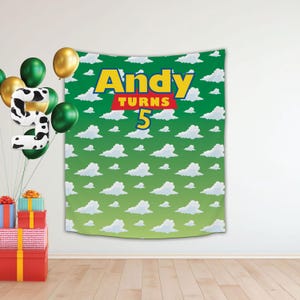 May include: Green and white backdrop with a white cloud pattern. The backdrop has the text "Andy Turns 5" in red, yellow, and blue letters.