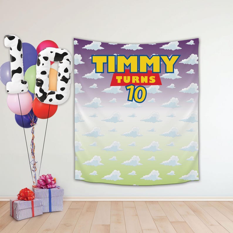 May include: A purple and white backdrop with a blue border and clouds printed on it. The backdrop has the text "TIMMY TURNS 10" in red and yellow letters. There are colourful balloons in front of the backdrop.
