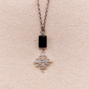 Adinkra Denkyem Funefu necklace, symbol of unity and diversity