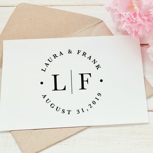 Wedding monogram logo design with first names, initials, and wedding date