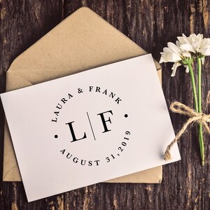 Wedding monogram logo design with first names, initials, and wedding date