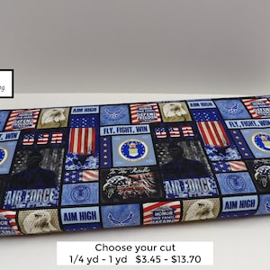 May include: Blue and red fabric with a patchwork design featuring the United States Air Force logo, American flags, and the words "Fly, Fight, Win" and "Aim High".
