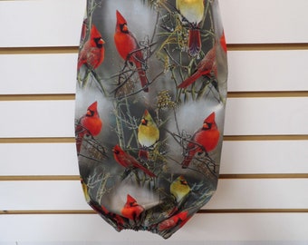 1496 Plastic bag holder with winter cardinals on bare branches; Large 28" L, 10-1/4" W. Bird lovers grocery bag holder with cardinal pairs.