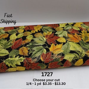 May include: Fabric with a black background and a pattern of colorful autumn leaves in shades of green, yellow, orange, and red. The fabric has the text "Fast Shipping" and "1727".