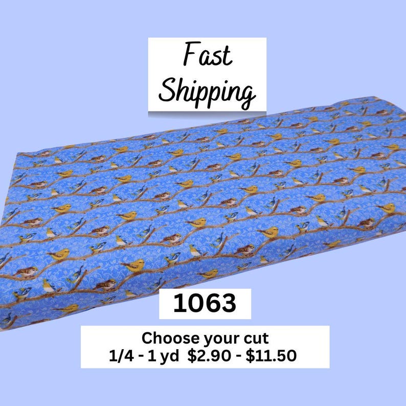 May include: Blue fabric with a repeating pattern of birds perched on brown branches. The fabric has a light blue background with small white dots. The text "Fast Shipping" is in the upper left corner. The number "1063" is in the center.